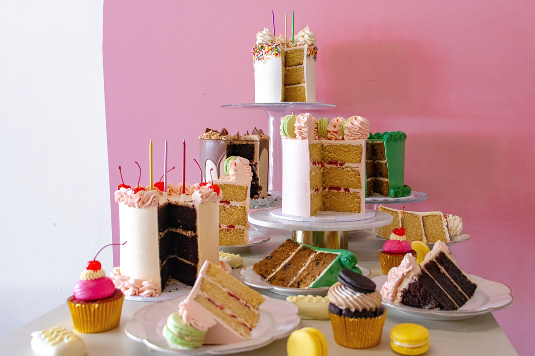 Table filled with celebration cakes