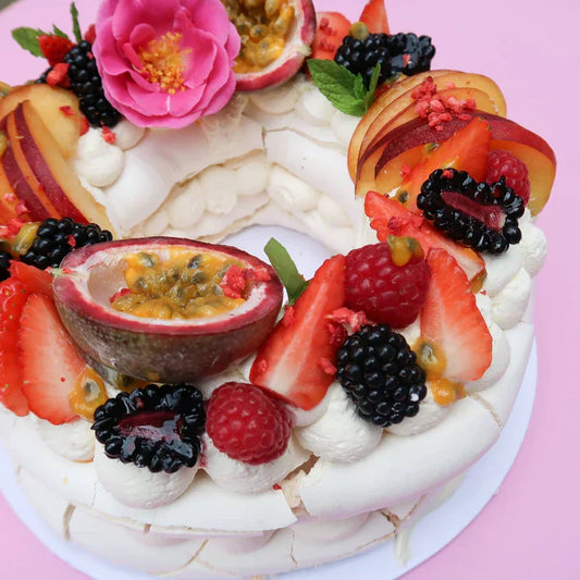 round pavlova with berries on top
