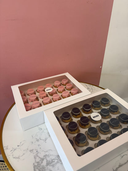 Close-up of custom branded mini cupcakes with logo decoration