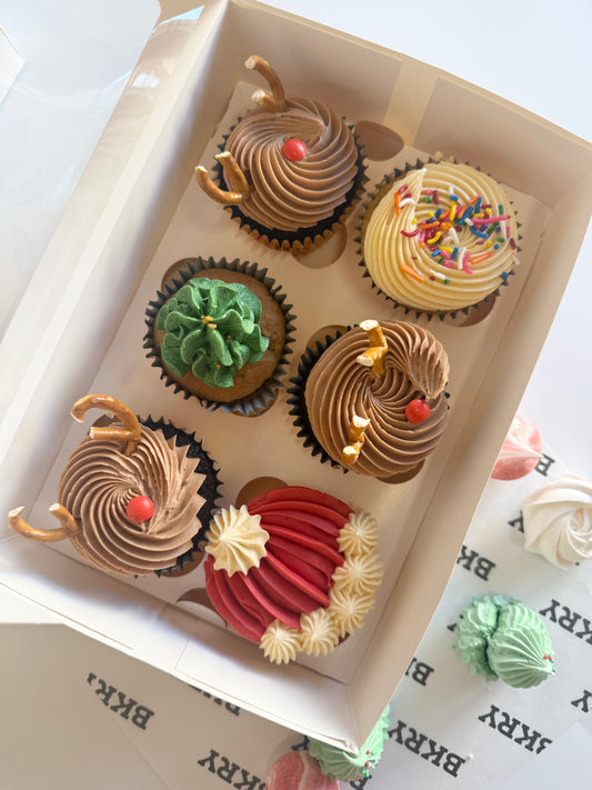Christmas cupcakes with festive buttercream trees and decorations