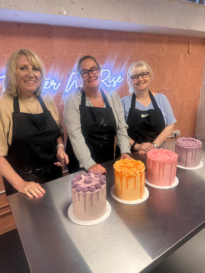 Student decorating a celebration cake at BKRY Academy