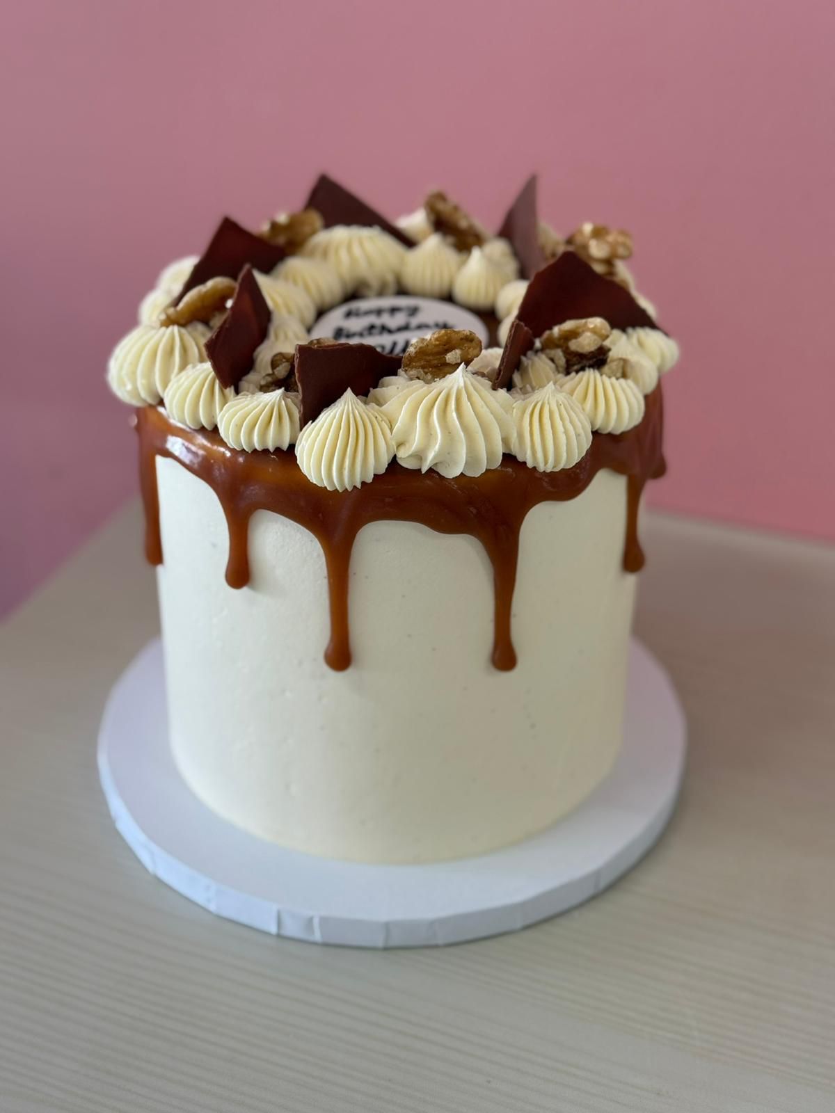 Tall Drip cake with chocolate drip and customised toppings