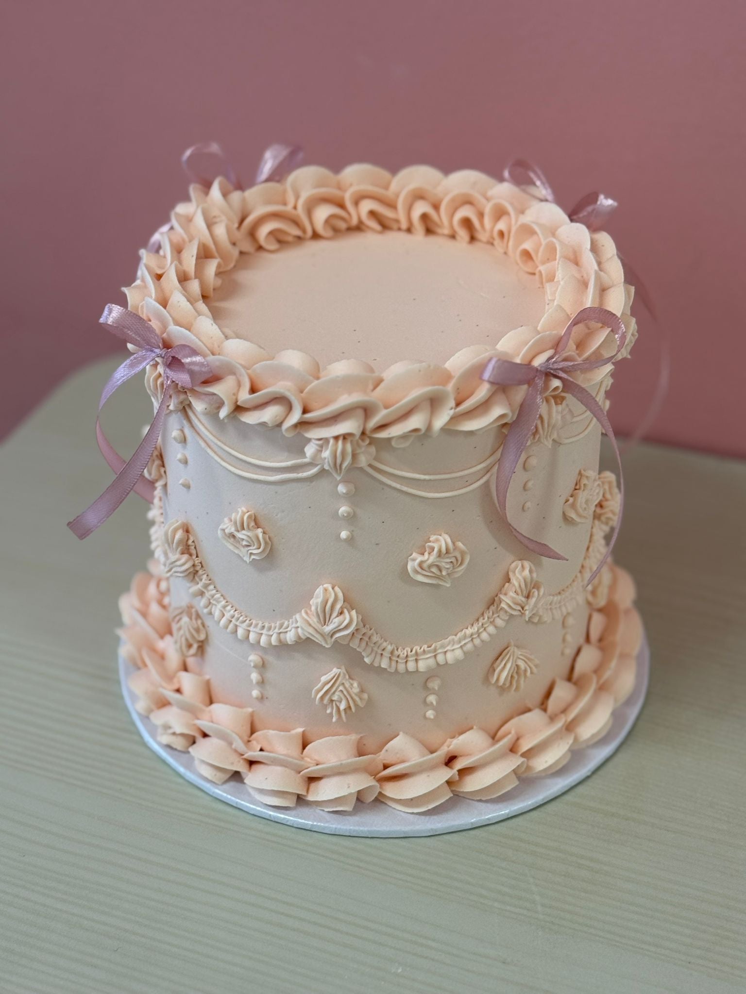 The Lambeth celebration cake with ornate vintage-style piping
