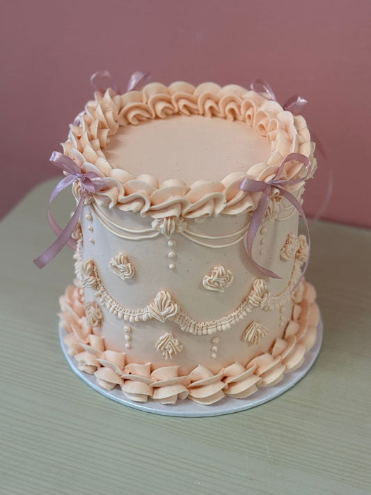 The Lambeth celebration cake with ornate vintage-style piping
