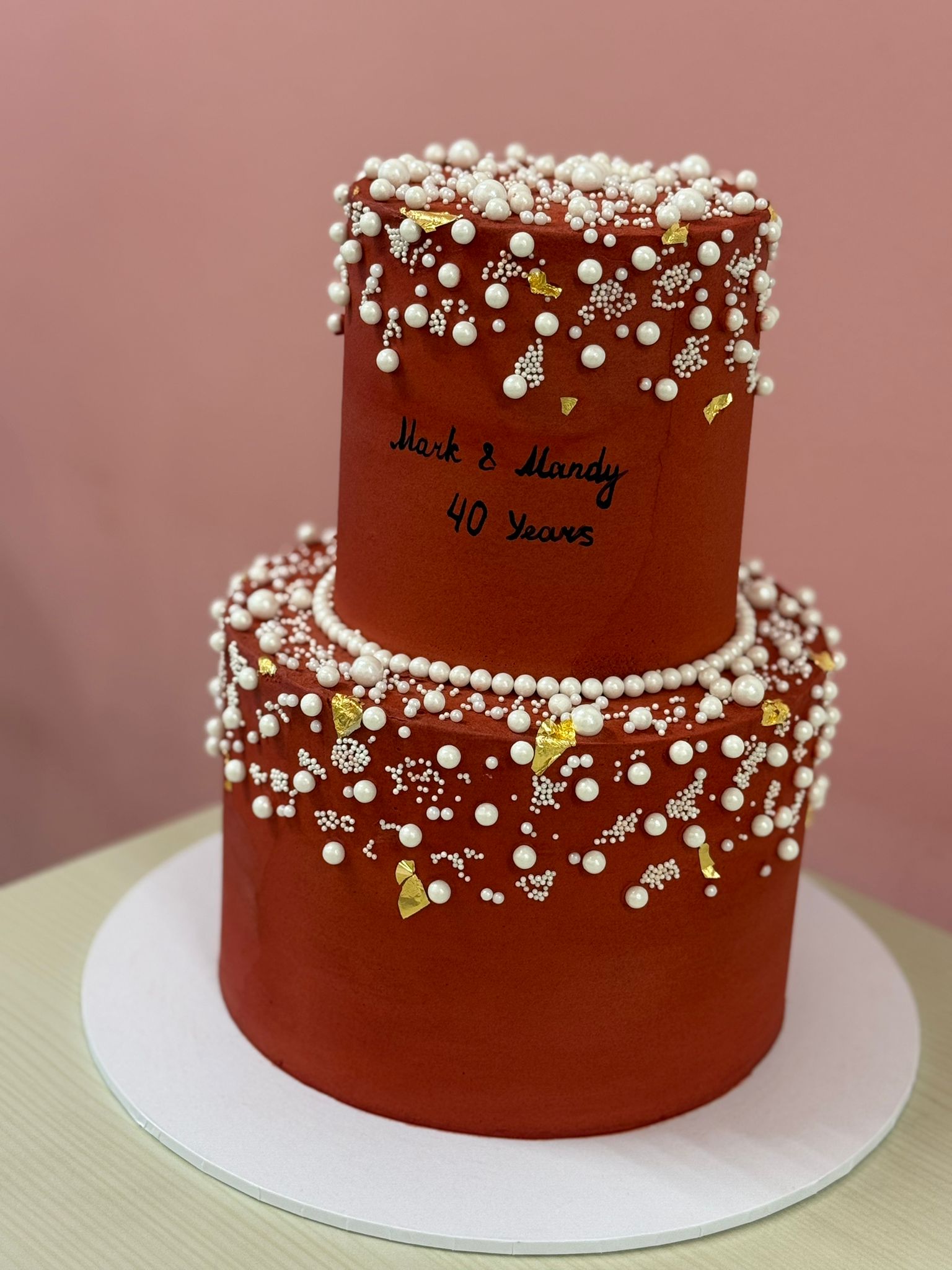 The Pearl cake side view showing layered buttercream decoration