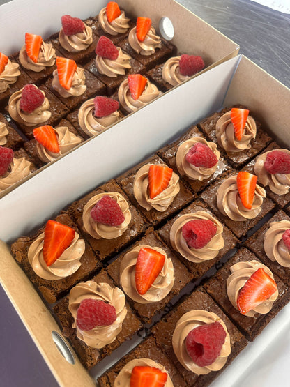 Close-up of loaded brownie bites with chocolate drizzle
