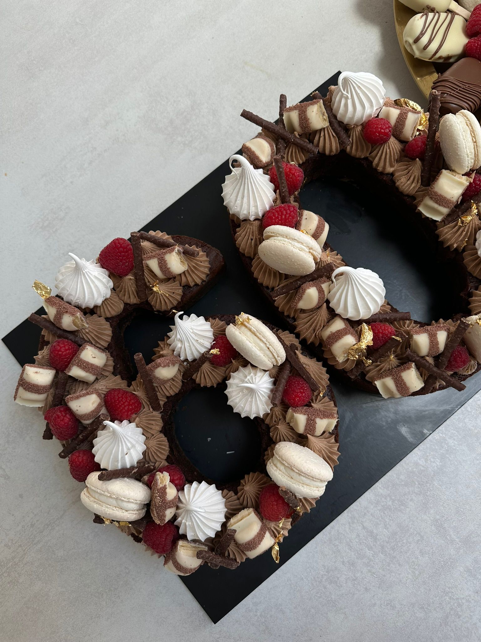 Brownie number cake with loaded sweet toppings by BKRY